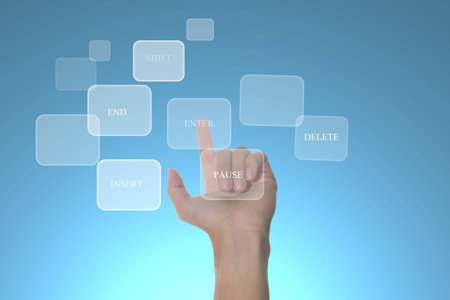 hand pushing a button touch screen