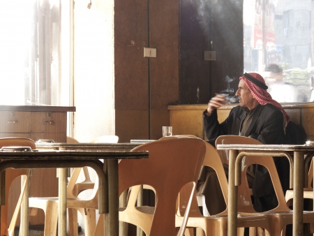 man smoking in aleppo syria cafeのeditorial素材