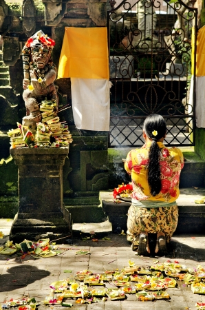 woman praying in temple bali indonesiaの写真素材