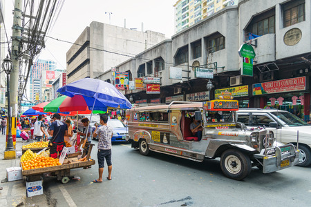 jeepney bus in manila chinatown street in philippinesのeditorial素材