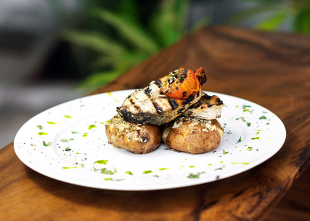 grilled fresh fish with roast potato herbs and garlic