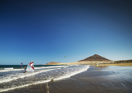 el medano surfing beach and montana roja landmark  in south tenerife spainのeditorial素材