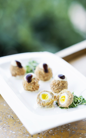 breaded pork and quail egg gourmet sophisticated modern cuisine starter snack foodの写真素材