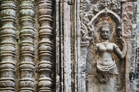 ancient asian stone carved figures in buddhist angkor wat temple cambodiaのeditorial素材
