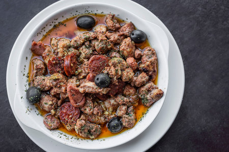pica pau traditional portuguese spicy sauce pork and sausage tapas snack
