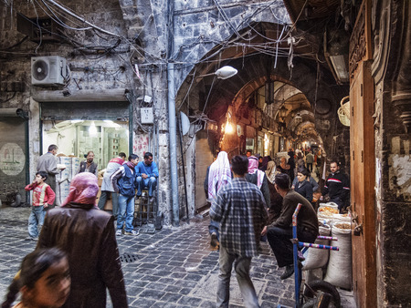 busy souk market shopping street in old town of aleppo syriaのeditorial素材