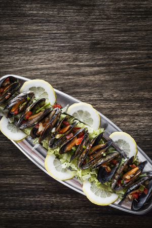 mussels in fresh zesty marinated citrus vegetable sauce seafood tapas snackの写真素材