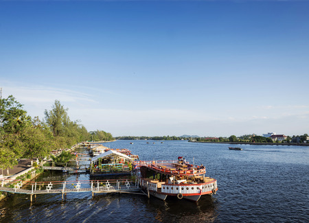 view of river boat tourist restaurants in kampot town cambodiaのeditorial素材