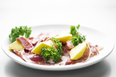 jamon serrano parma prosciutto style smoked ham with mango fruit starter tapasの写真素材