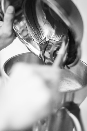 making gelato ice cream with modern professional equipment preparation detail in kitchen interior black and white photoの写真素材