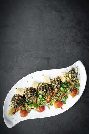 spicy asian stir fried prawns with garlic and kampot pepper sauce in cambodiaの写真素材