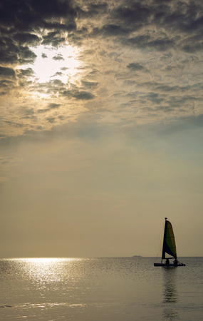 sailing boat at sea during sunset in phuket coast of thailandの写真素材