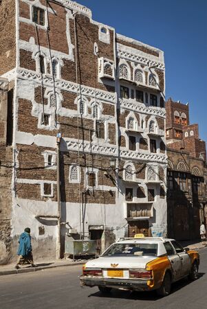 street scene and local heritage architecture buildings in old town of sanaa yemenのeditorial素材