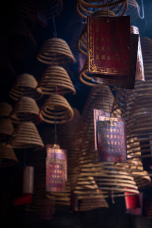 traditional burning incense coils inside chinese a-ma buddhist temple in macau chinaのeditorial素材