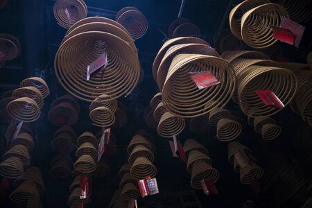 traditional burning incense coils inside chinese a-ma buddhist temple in macau chinaのeditorial素材