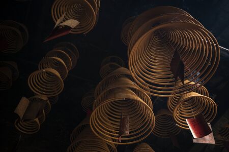 traditional  burning incense coils inside chinese a-ma buddhist temple in macau chinaのeditorial素材