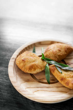 traditional brazilian beef rissol fried tapas snack on wooden plate in rio de janeiro restaurantの写真素材