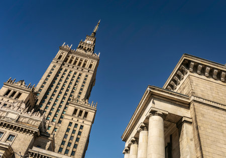 Palace of Culture and Science landmark building exterior in warsaw poland on sunny dayの写真素材