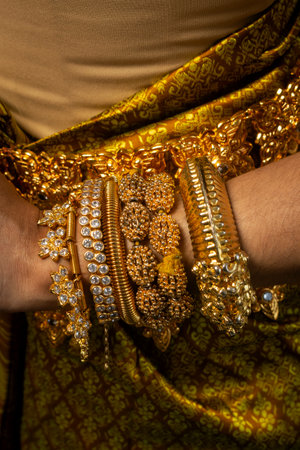 close detail of Khmer apsara performer costume and traditional dance on black background in cambodiaの写真素材