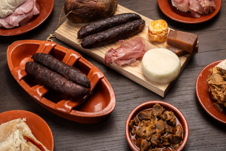 assortment of many different traditional Portuguese tapas snack food on restaurant table in porto portugalの写真素材