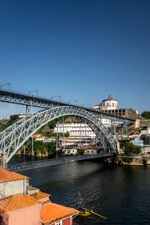 Dom Luis I bridge iconic landmark and riverside of old town of Porto Portugalのeditorial素材