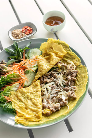 Banh xeo vietnamese traditional food pancake crepe with pork and salad in Da Nang Vietnam