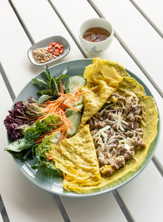 Banh xeo vietnamese traditional food pancake crepe with pork and salad in Da Nang Vietnamの写真素材
