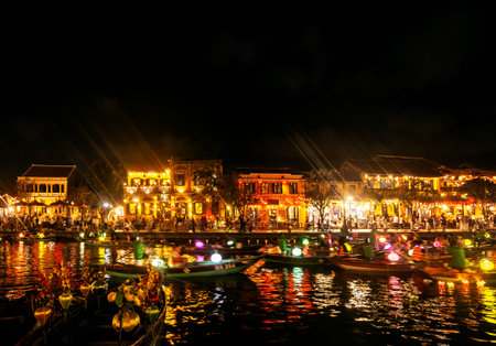 HOI AN, VIETNAM - FEBRUARY 8 2026: hoi an old town riverside view with tourist lantern river boats in vietnam at nightのeditorial素材