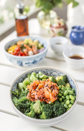 smoked salmon and green vegetable healthy poke bowl on white table in melbourne australia cafe