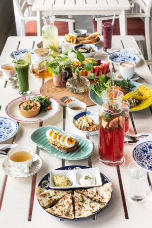 mixed western healthy food meal on restaurant table outdoors in singapore garden cafe restaurant