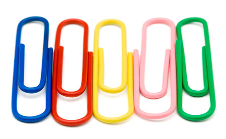Multi-colored paper clips isolated over white