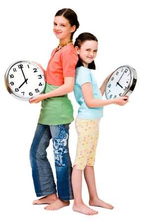 Cute girls holding clocks isolated over whiteの写真素材