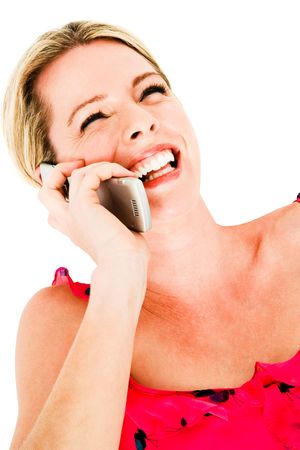 Mid adult woman talking on a mobile phone isolated over whiteの写真素材