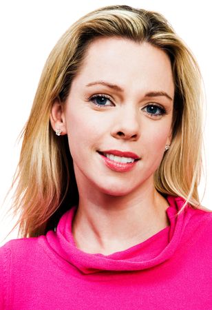 Smiling mid adult woman posing and smiling isolated over whiteの写真素材