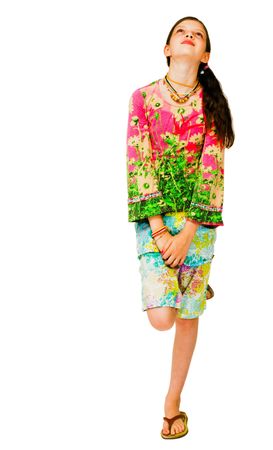 Beautiful girl day dreaming and smiling isolated over whiteの写真素材