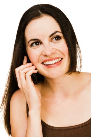 Young woman talking on a mobile phone isolated over whiteの写真素材