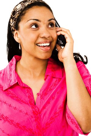 Beautiful woman talking on a mobile phone isolated over whiteの写真素材