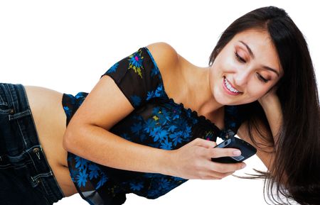 Close-up of a woman text messaging on a mobile phone isolated over whiteの写真素材