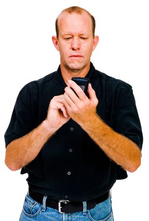 Close-up of a man text messaging on a mobile phone isolated over whiteの写真素材