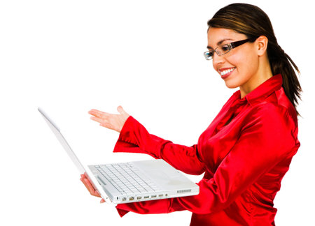 Latin American woman using a laptop and smiling isolated over whiteの写真素材