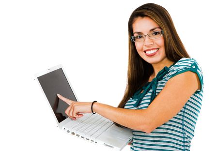 Mid adult woman using a laptop and smiling isolated over whiteの写真素材