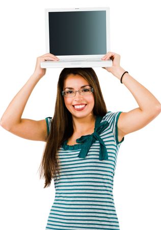 Smiling woman holding a laptop isolated over whiteの写真素材