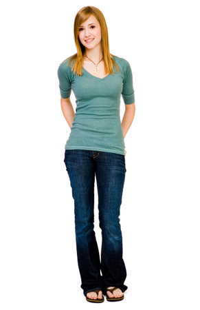 Portrait of a young woman posing and smiling isolated over whiteの写真素材