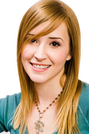 Close-up of a young woman smiling and posing isolated over whiteの写真素材