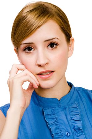 Beautiful woman thinking and posing isolated over whiteの写真素材