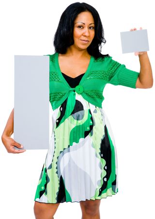 Mixedrace woman showing placards and posing isolated over whiteの写真素材
