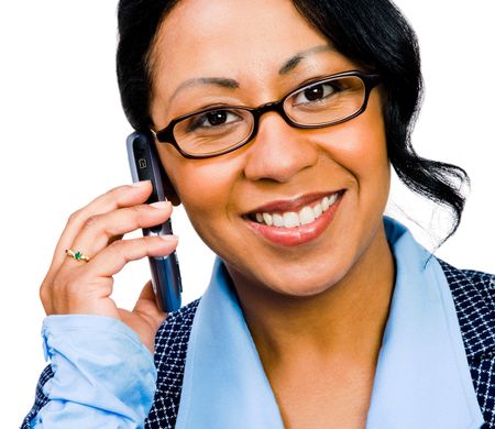 Happy businesswoman talking on a mobile phone isolated over whiteの写真素材