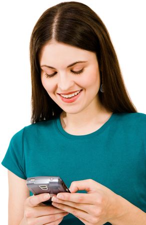 Happy woman text messaging on a mobile phone isolated over whiteの写真素材