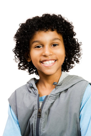 Latin American boy smiling isolated over whiteの写真素材