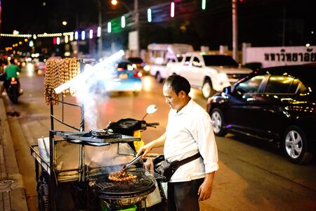 Another good career.Is a trading profession one merchant is selling sausage east  grill in front of Ramkhamhaeng University 2. At the Songkran Festival on April 21, 2018のeditorial素材